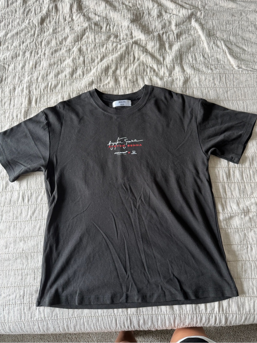 Black Short-Sleeve Crewneck Tee with Small Red and White Chest Script